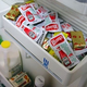 A drawer in Turnbee's refrigerator overflows with excess restaurant condiments.